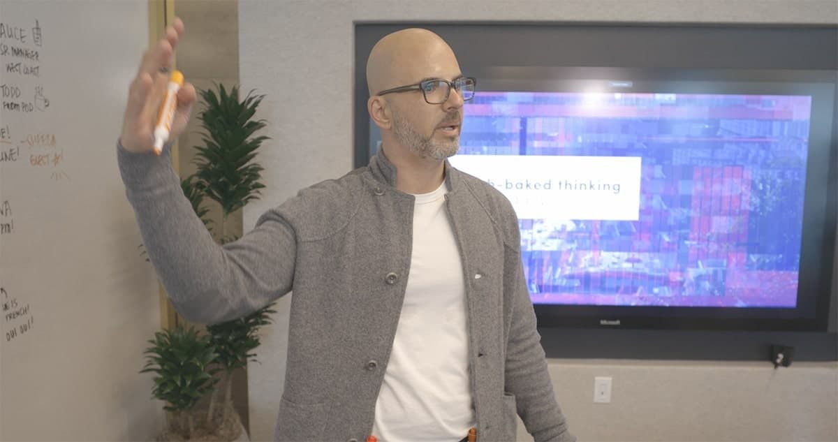 Chris Rubin at a whiteboard in a working session