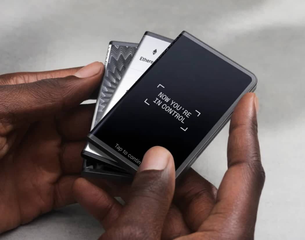 Ledger Stax devices held in a hand