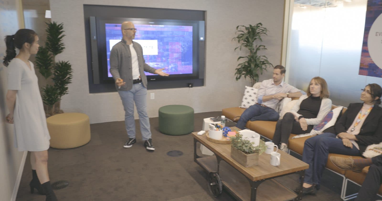 Chris Rubin at a whiteboard with a pitch team